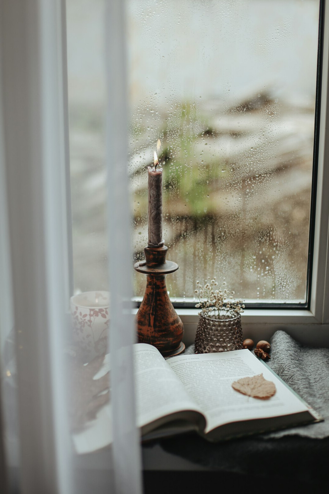rainy window with book