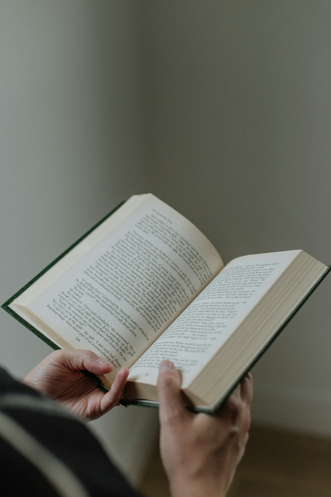 person reading mystery book